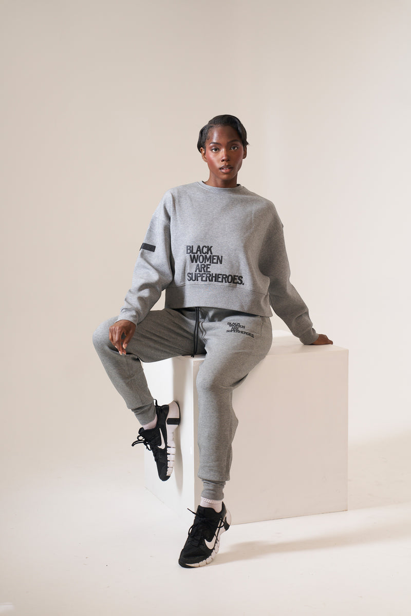 Actively Black Athleisure Wear grey fleece oversized crewneck sweatshirt with puff print logo and matching joggers.