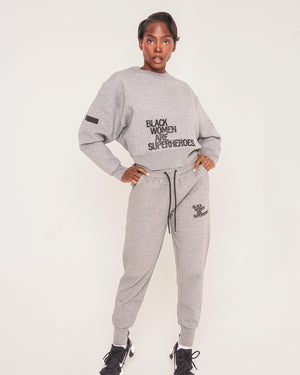 Actively Black Athleisure Wear grey fleece oversized crewneck sweatshirt and joggers with puff print logos.