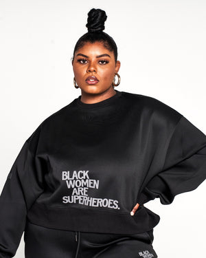Actively Black Athleisure Wear women's black oversized crewneck sweatshirt with puff print logo and fleece fabric.