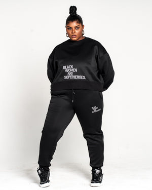 Actively Black Athleisure Wear women's black oversized crewneck sweatshirt with puff print logo and matching joggers.