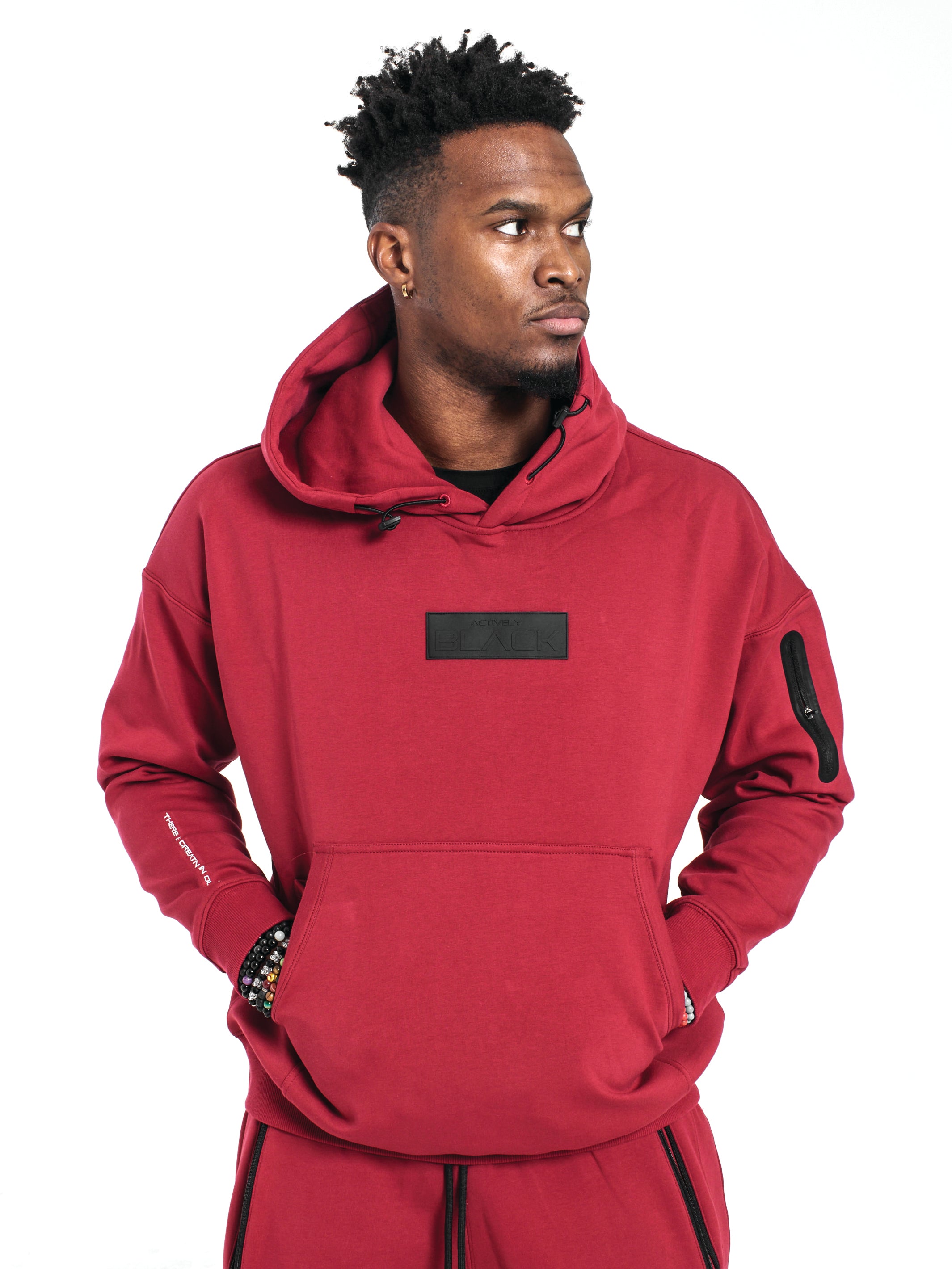 https://activelyblack.com/cdn/shop/products/UnisexRubberPatchHoodieWineProductImage3.jpg?v=1676007050&width=2130